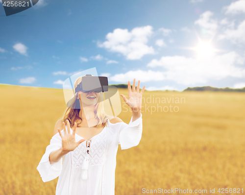 Image of woman in virtual reality headset on cereal field