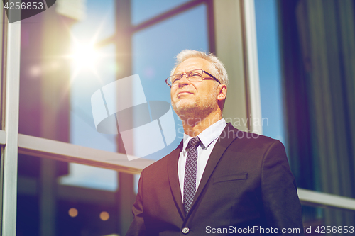 Image of senior businessman on city street