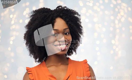 Image of happy african american young woman over white