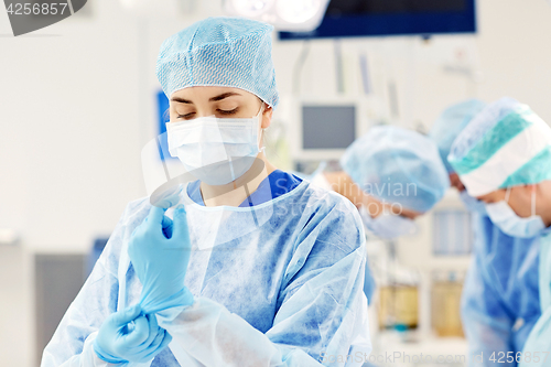 Image of surgeon in operating room at hospital