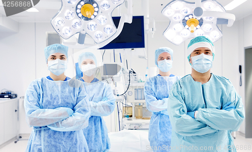 Image of group of surgeons in operating room at hospital