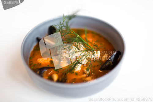 Image of seafood soup with fish and blue mussels in bowl