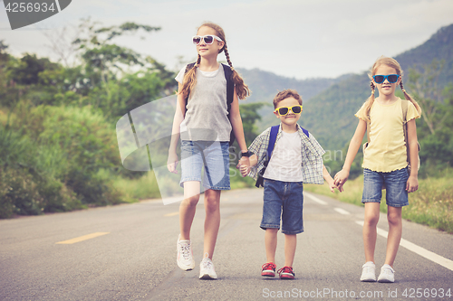 Image of Happy children walking on the road.