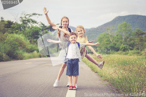 Image of Happy children walking on the road.