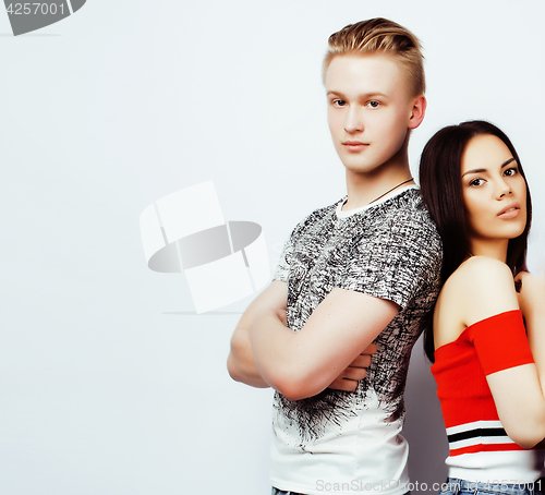 Image of young pretty teenage couple, hipster guy with his asian girlfriend happy smiling and hugging isolated on white background, lifestyle people concept close up, diverse nations relationship 