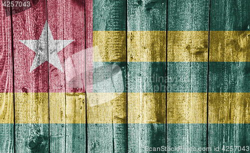 Image of Flag of Togo on weathered wood