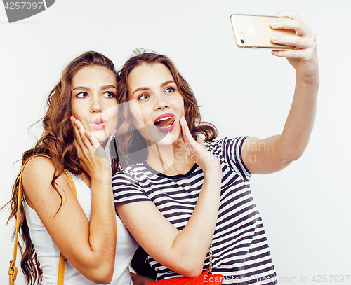 Image of best friends teenage girls together having fun, posing emotional on white background, besties happy smiling, lifestyle people concept close up