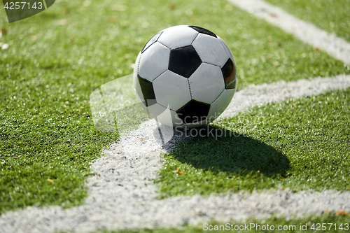 Image of soccer ball on football field