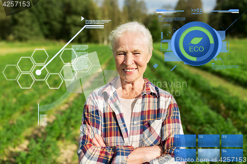 Image of happy senior woman at farm