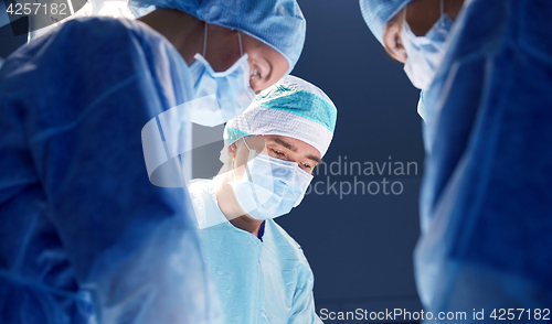 Image of group of surgeons in operating room at hospital