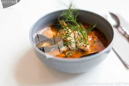 Image of seafood soup with fish and blue mussels in bowl