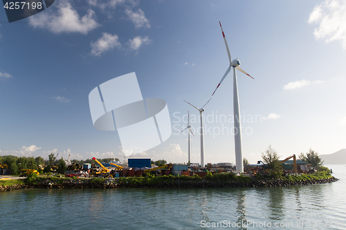 Image of turbines at wind farm on sea shore