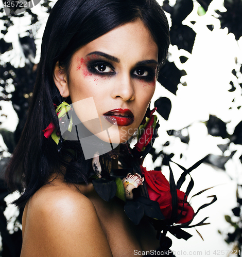 Image of pretty brunette woman with rose jewelry, black and red, bright m
