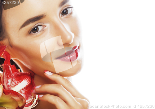 Image of young pretty brunette woman with red flower amaryllis close up i