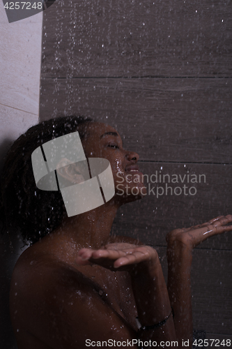 Image of African American woman in the shower