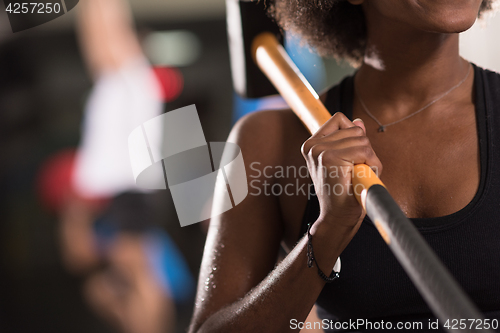 Image of black woman after workout with hammer