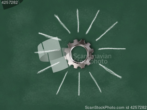 Image of gear wheel on chalkboard with sunbeams - 3d rendering