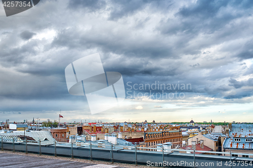 Image of Panoramic view of Riga city, roofs under cloudy sky