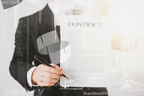 Image of close up of businessman holding contract paper