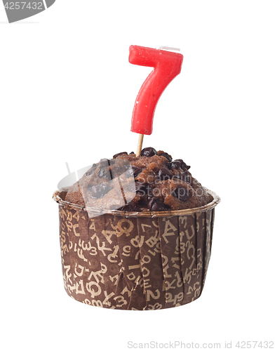 Image of Chocolate muffin with birthday candle for seven year old