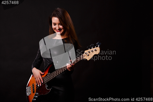 Image of Photo of girl with guitar