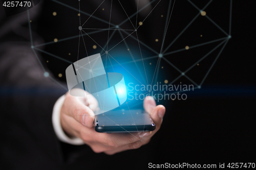 Image of Businessman holding blue crystal ball