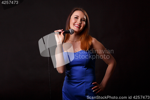 Image of Beautiful singer in blue dress