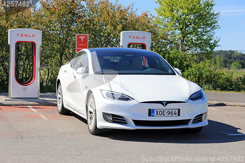 Image of New White Tesla Model S Electric Car Charging 