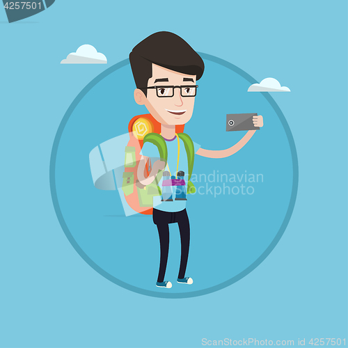 Image of Man with backpack making selfie.