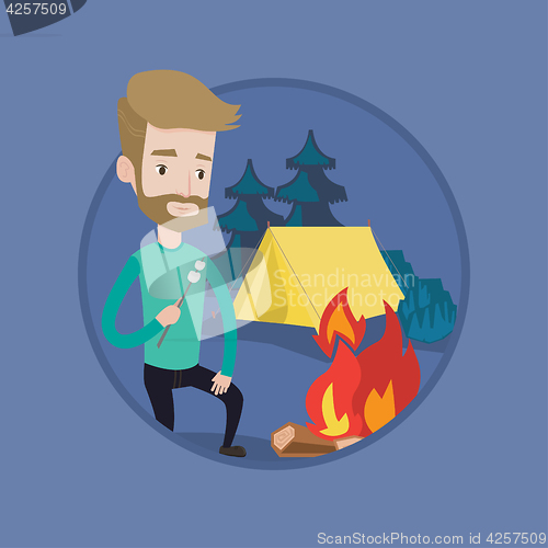 Image of Businessman roasting marshmallow over campfire.