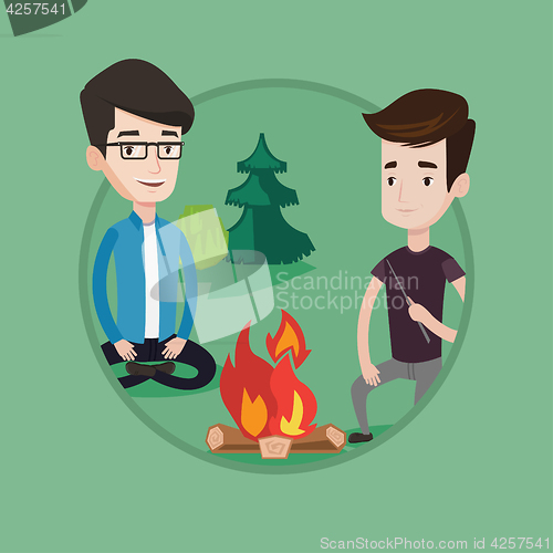 Image of Two friends sitting around bonfire in camping.