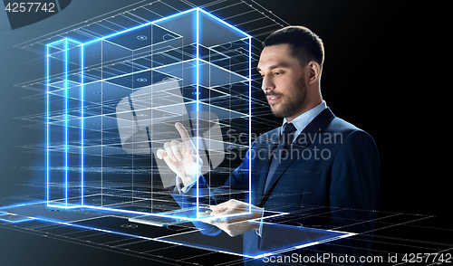 Image of businessman with tablet pc and building hologram