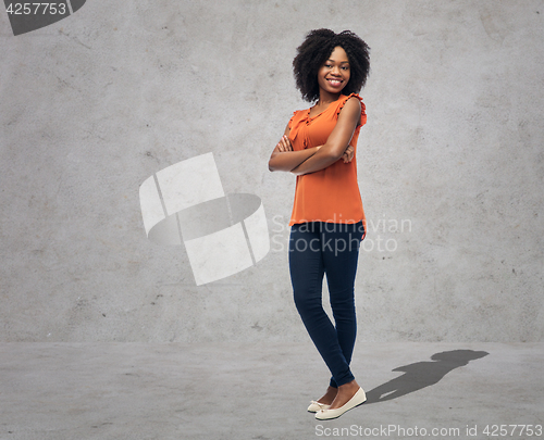 Image of happy african american young woman over white