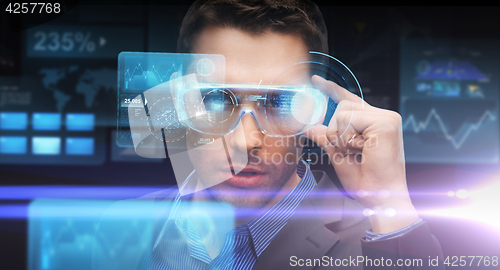 Image of businessman in virtual reality or 3d glasses