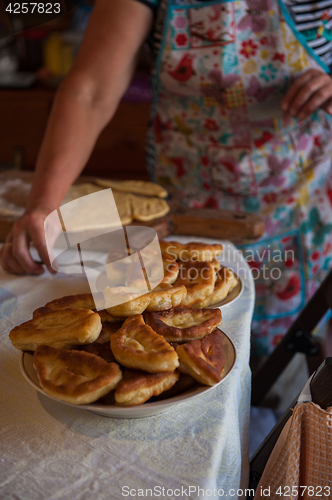 Image of Grandmother bakes pies