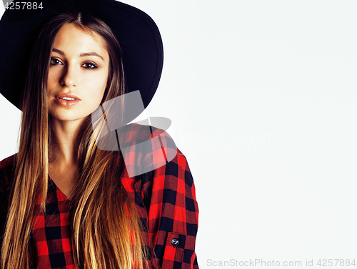 Image of young pretty brunette girl hipster in hat on white background casual close up dreaming smiling