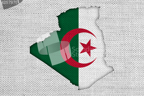 Image of Map and flag of Algeria on old linen