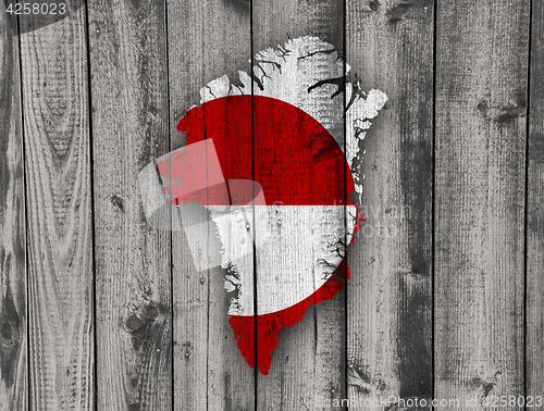 Image of Map and flag of Greenland on weathered wood
