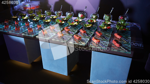 Image of Beautifully decorated catering banquet table with different food snacks.