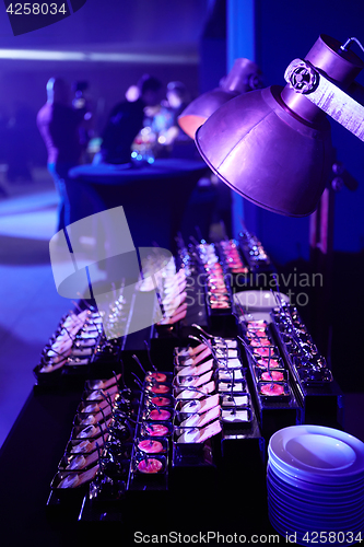 Image of Beautifully decorated catering banquet table with different food snacks.