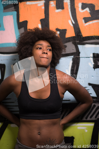 Image of black woman after a workout at the gym