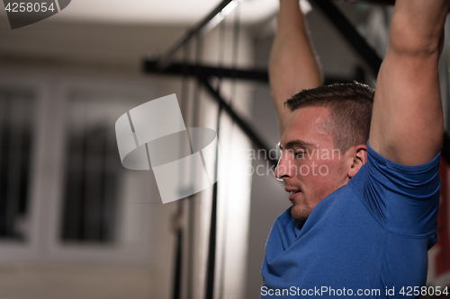 Image of man doing pull ups