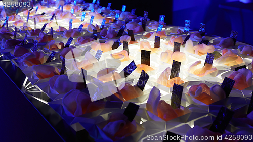 Image of Beautifully decorated catering banquet table with different food snacks.
