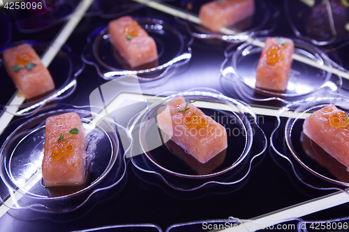 Image of Beautifully decorated catering banquet table with different food snacks.