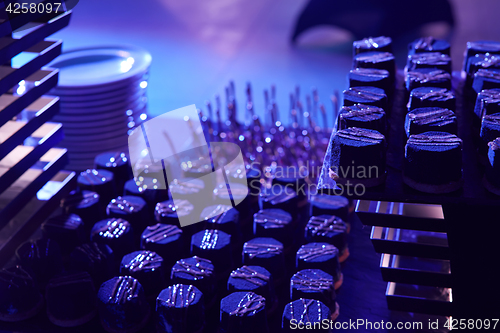Image of stylish luxury decorated orange candy bar for the celebration of a wedding of happy couple, cathering in the restaurant.