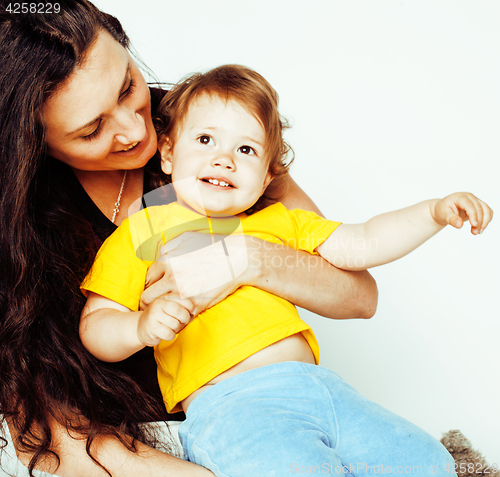 Image of pretty real normal mother with cute blond little daughter close up isolated on white background, lifestyle people concept