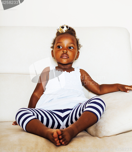 Image of little cute african american girl playing at home, pretty adorab