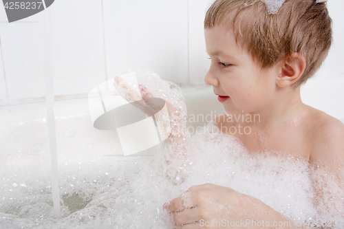 Image of baby bathed with foam