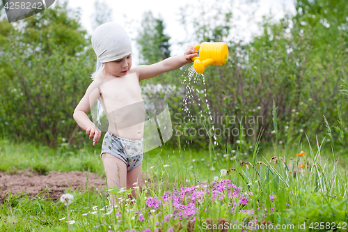 Image of girl watering flowers