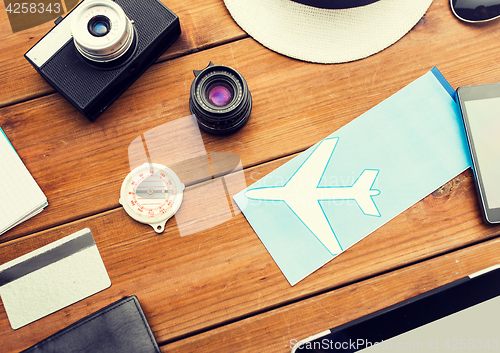 Image of close up of camera and traveler personal stuff